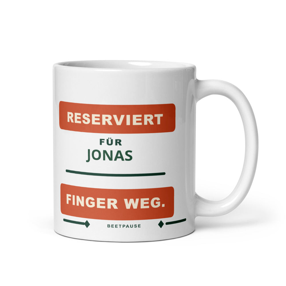 Personalisierte weiße Gartentasse mit Name Jonas und Spruch „Reserviert für – Finger weg.“